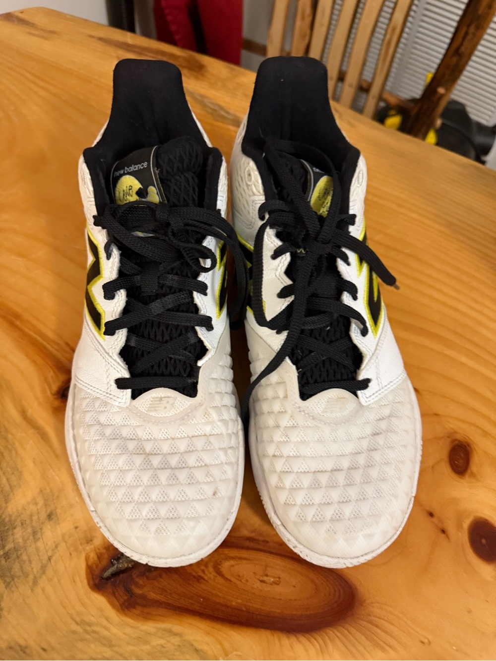 New Balance womens White and Black Athletic Sneakers with Yellow Accents